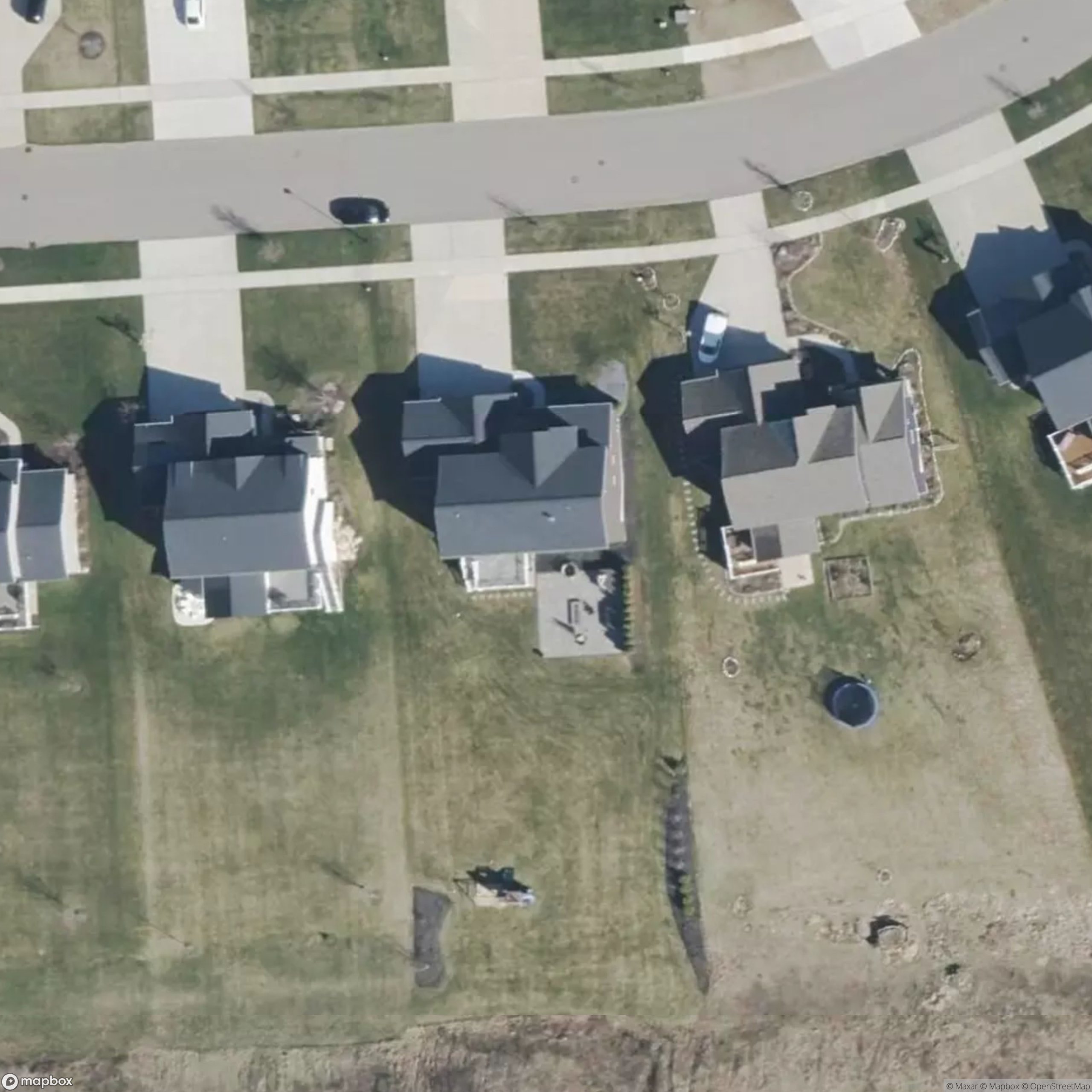 Actual residential aerial showing mapped lawn around a house, its street-side verge and maintained rear extension